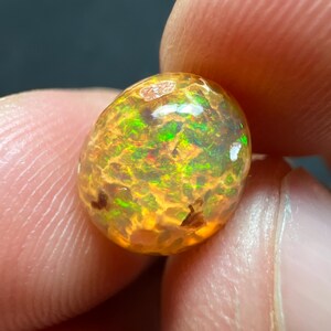 Amazing fire opal on matrix with its beautiful sparkles and landscapes AAA quality weight 3.45 carats measure 17x13x9 mm image 1