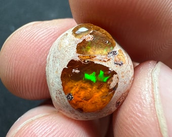 Amazing fire opal on matrix with its beautiful sparkles and landscapes AAA quality weight 4.70 carats measure 14x13x4.5mm