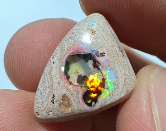 Amazing fire opal on matrix with its beautiful sparkles and landscapes AAA quality weight 10.75 carats measure 21x15x6 mm