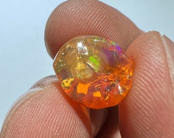 Amazing pregnant fire opal with its inclusions and inlays of ritile AAA quality weight 8.45 carats measure 14x12x10mm