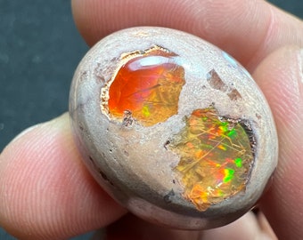 Amazing fire opal on matrix with its beautiful sparkles and landscapes AAA quality weight 50.20 carats measure 26x21x15mm