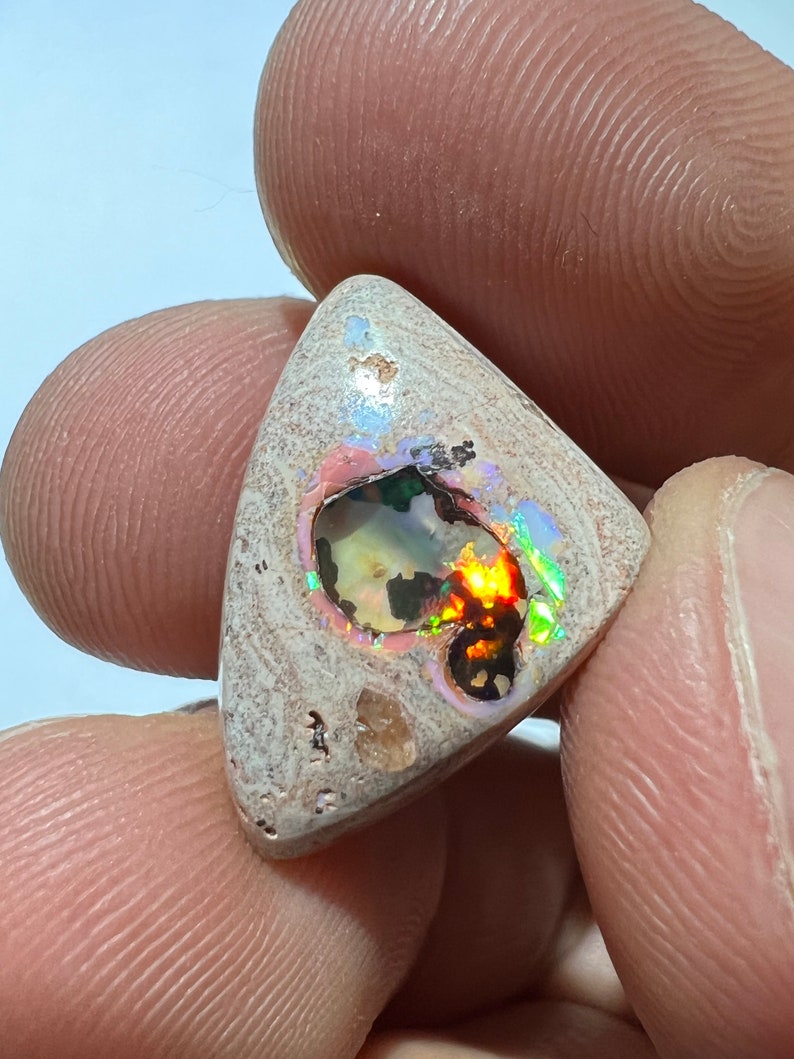 Amazing fire opal on matrix with its beautiful sparkles and landscapes AAA quality weight 10.75 carats measure 21x15x6 mm image 2