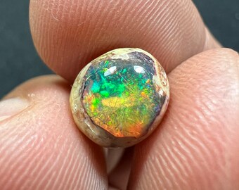 Amazing opal galaxy with its beautiful sparkles. AAA quality weight 2.70 carats measure 9.5x9x6mm man made treated