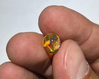 Incredible fire opal with its beautiful sparkles in the rain and its quarry inlay AAA quality weight 2.15 carats size 9x8x5mm