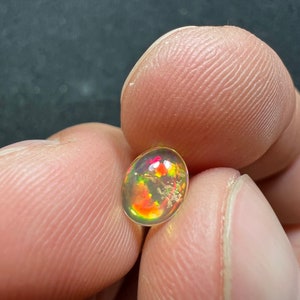 Amazing fire opal with its beautiful sparkles and quarry inlay AAA quality weight 0.65 carats measure 7.5x6x3mm image 8