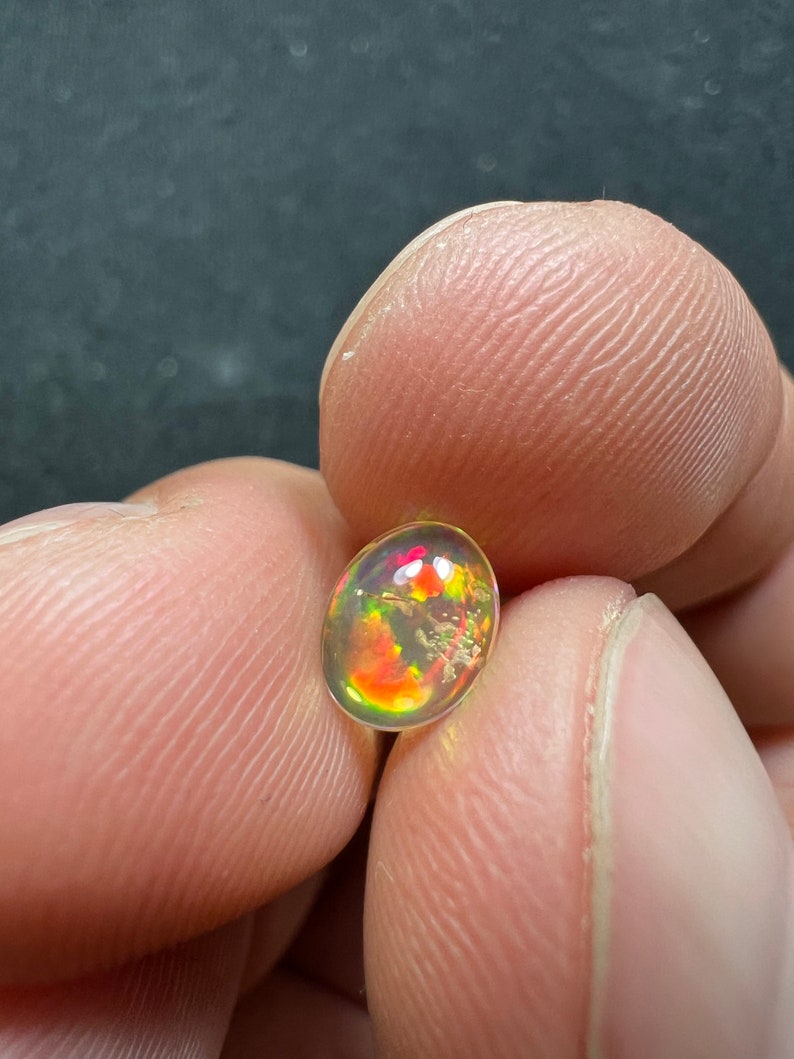 Amazing fire opal with its beautiful sparkles and quarry inlay AAA quality weight 0.65 carats measure 7.5x6x3mm image 8