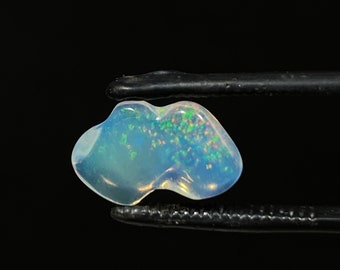 amazing water opal with its beautiful blue rain sparkles  weight 2.95 carats AA quality measure 14.5x9x4mm