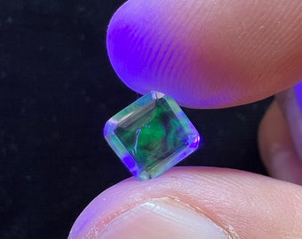 Amazing hyalite opal that reflects its sparkles with neon light AAA quality weight 1.45 carats measure 8x8x3.5mm