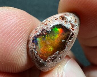 Amazing fire opal on matrix with its beautiful sparkles and landscapes AAA quality weight 5.50 carats measure 16x10.5x5.5 mm