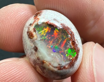 Amazing fire opal on matrix with its beautiful sparkles AAA quality weight 19.20 carats measure 20x16x9 mm