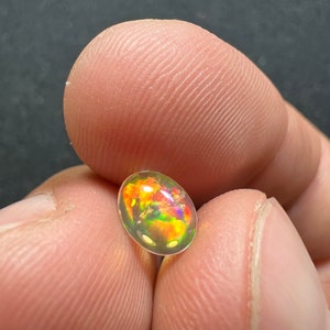 Amazing fire opal with its beautiful sparkles and quarry inlay AAA quality weight 0.65 carats measure 7.5x6x3mm image 6