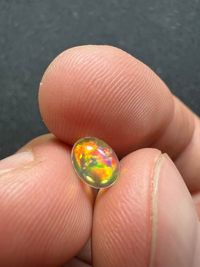 Amazing fire opal with its beautiful sparkles and quarry inlay AAA quality weight 0.65 carats measure 7.5x6x3mm image 6