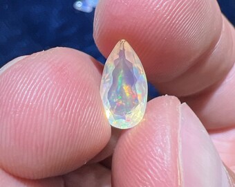 Amazing faceted water opal with its beautiful sparkles and rutile inlays AAA quality weight 1.25 carats measure 11.5x6x4mm