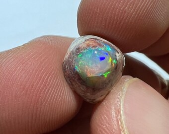 Amazing magical fire opal on matrix with its beautiful sparkles AAA quality weight 4.40 carats measure 12x11x8mm