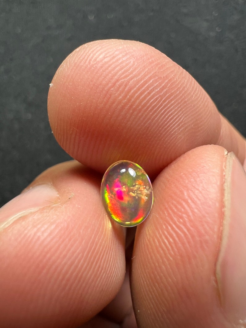 Amazing fire opal with its beautiful sparkles and quarry inlay AAA quality weight 0.65 carats measure 7.5x6x3mm image 10