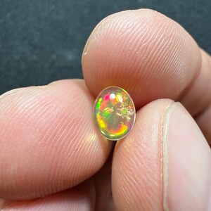 Amazing fire opal with its beautiful sparkles and quarry inlay AAA quality weight 0.65 carats measure 7.5x6x3mm image 3