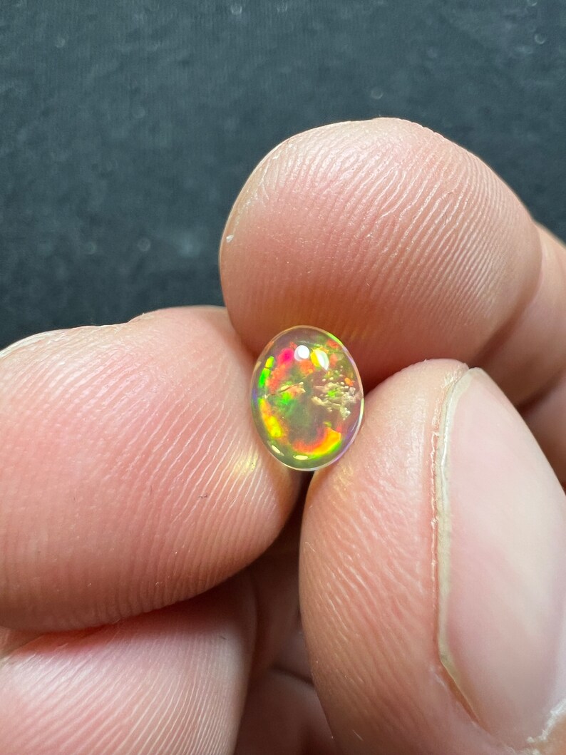 Amazing fire opal with its beautiful sparkles and quarry inlay AAA quality weight 0.65 carats measure 7.5x6x3mm image 3