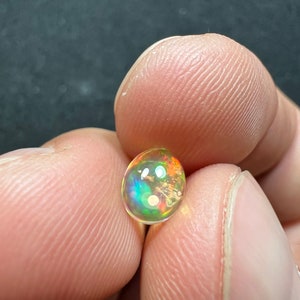 Amazing fire opal with its beautiful sparkles and quarry inlay AAA quality weight 0.65 carats measure 7.5x6x3mm image 4