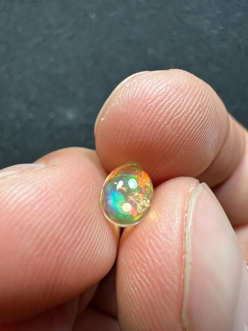 Amazing fire opal with its beautiful sparkles and quarry inlay AAA quality weight 0.65 carats measure 7.5x6x3mm image 4