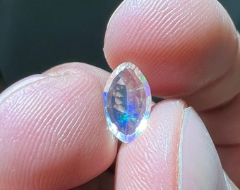 Amazing faceted water opal with its beautiful sparkles and rutile inlays AAA quality weight 1.05 carats measure 10.5x6.5x3mm