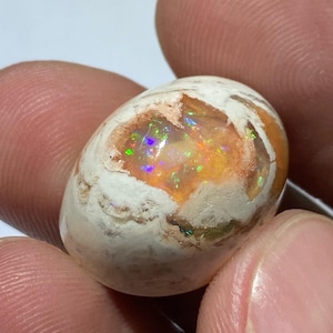 amazing pregnant fire opal in matrix with its beautiful sparkles  AA quality weight 24.15 carats measure 22x17x12mm