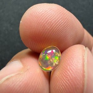 Amazing fire opal with its beautiful sparkles and quarry inlay AAA quality weight 0.65 carats measure 7.5x6x3mm image 9