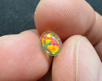 Amazing fire opal with its beautiful sparkles and quarry inlay AAA quality weight 0.65 carats measure 7.5x6x3mm