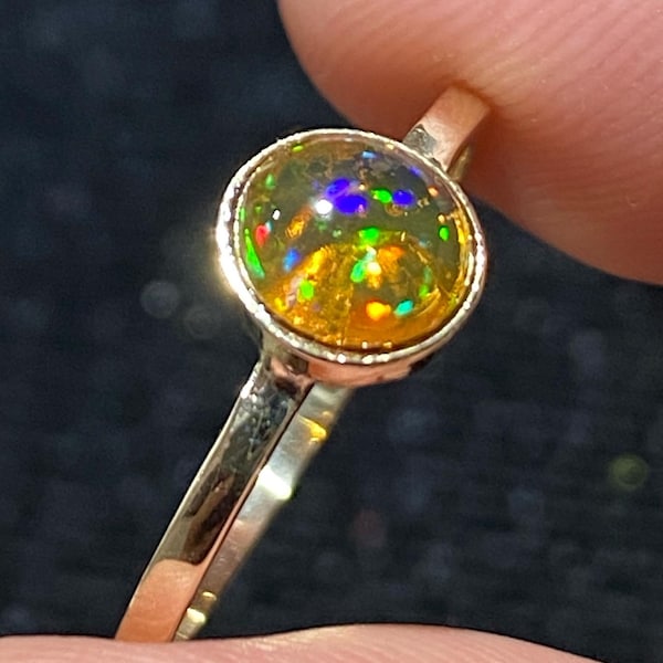 Gorgeous 10k gold ring with its pretty fire opal with its beautiful rainbow glow  10k gold  total weight 8.30 carats size 8 1/4