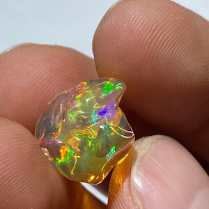 impressive Mexican fire opal with its incredible colors  AAA quality Free form weight 10.80 carats measure 16x14x11mm