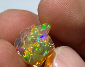 impressive Mexican fire opal with its incredible colors  AAA quality Free form weight 10.80 carats measure 16x14x11mm