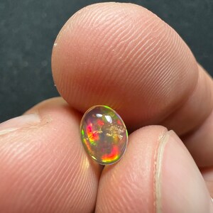 Amazing fire opal with its beautiful sparkles and quarry inlay AAA quality weight 0.65 carats measure 7.5x6x3mm image 7