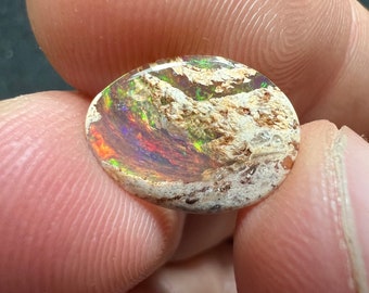 Amazing fire opal on matrix with its beautiful sparkles and landscapes AAA quality weight 1.95 carats measure 14x10x2mm