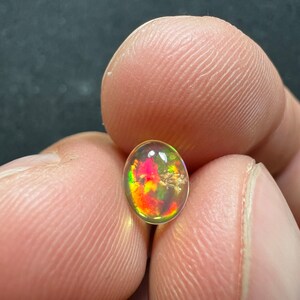 Amazing fire opal with its beautiful sparkles and quarry inlay AAA quality weight 0.65 carats measure 7.5x6x3mm image 5