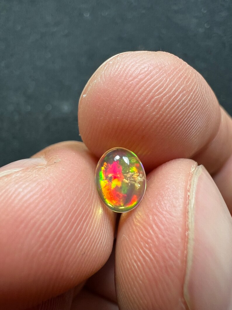 Amazing fire opal with its beautiful sparkles and quarry inlay AAA quality weight 0.65 carats measure 7.5x6x3mm image 5