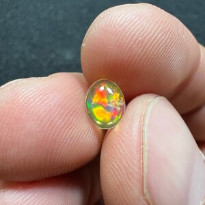 Amazing fire opal with its beautiful sparkles and quarry inlay AAA quality weight 0.65 carats measure 7.5x6x3mm image 2