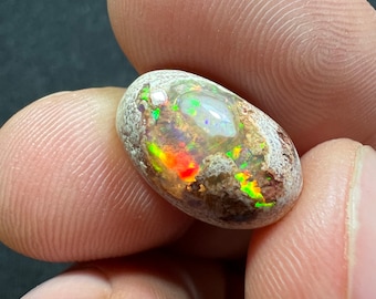 Amazing fire opal on matrix with its beautiful sparkles AAA quality weight 7.40 carats measure 16x10x7 mm