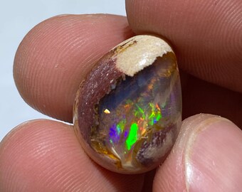 amazing fire opal in matrix with its beautiful rainbow sparkles   weight 13.55 carats measure 20x15x8mm