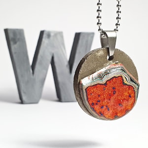 Necklace with pendants made of concrete and layers of graffiti paint. Upcycling jewelry graffiti jewelry