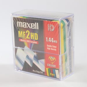 May include: A clear plastic case containing 10 Maxell MF2HD 1.44 MB high density floppy disks. The disks are double-sided and colour-coded. The case is labelled "Maxell HD MF2HD Windows DOS Formatted 1.44 MB Double Sided High Density Super HD Colour 10 pcs."