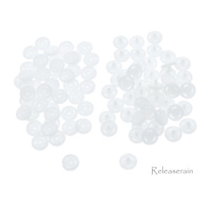 May include: A large quantity of white plastic buttons, ideal for crafts and sewing projects. The buttons are round with a small raised center and a flat back.