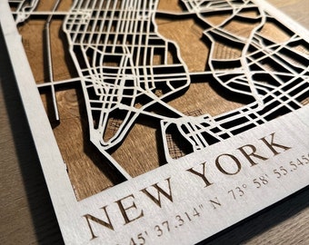 Laser-cut 3D wooden topographic map of any city, perfect as a gift.