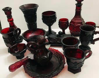 Avon Ruby Red 1876 Cape Cod Collection; Butter Dish, Cake Knife, Cruet, Plates, Sugar and Creamer, Vase, Decanter, Goblets