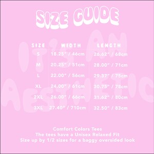 May include: A light pink size guide chart for Comfort Colors unisex relaxed fit tees. The table lists sizes S through 3XL with width and length measurements in inches, ranging from 18.25 inches to 27.40 inches wide and 26.62 inches to 32.50 inches long.
