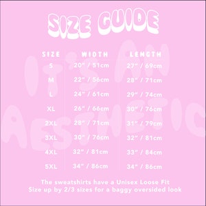 May include: A pink size guide chart for unisex sweatshirts with white text. It lists sizes S through 5XL with corresponding widths and lengths in inches and centimeters. The text reads: SIZE GUIDE, SIZE, WIDTH, LENGTH, and The sweatshirts have a Unisex Loose Fit. Size up by 2/3 sizes for a baggy oversized look.