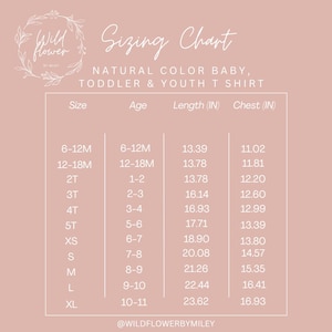 May include: A pink sizing chart for natural color baby, toddler, and youth t-shirts. The chart includes sizes, ages, lengths in inches, and chest measurements in inches. The Wildflower by Miley logo is at the top left.