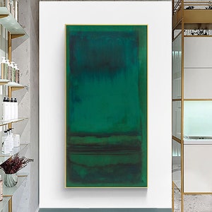 Puede incluir: Pintura abstracta con un esquema de color verde y azul. La pintura est&aacute; enmarcada en un marco dorado y est&aacute; colgada en una pared blanca.