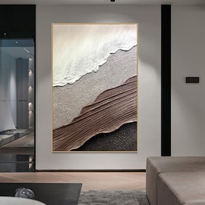 May include: Abstract painting with brown, white, and gray textured brushstrokes. The painting is framed in a thin gold frame.