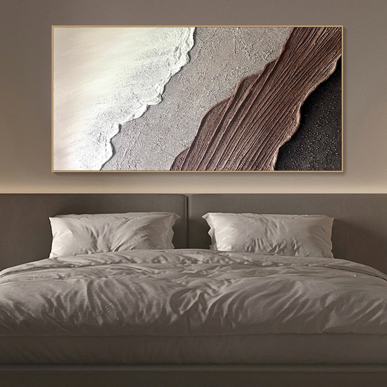 May include: Abstract painting with a textured, layered design. The painting features a white wave-like shape on a gray background, with a brown, textured shape on the bottom right.