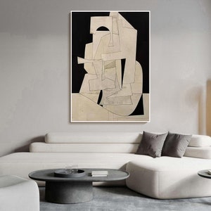 May include: Abstract art print featuring a white and gray geometric design on a black background. The design is made up of overlapping shapes and lines, creating a sense of depth and movement.