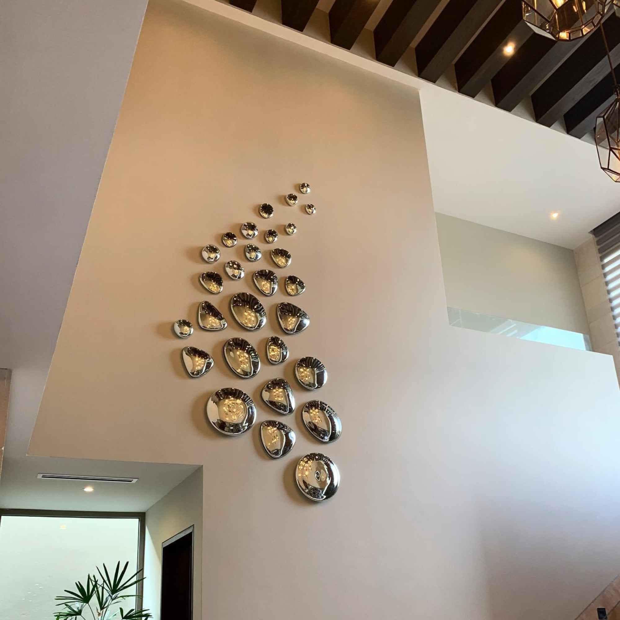 Photo inspiration: Decorative Recycled Glass Wall Decals Reference: Marey Silver Mirrorized Hanging Stones Hand Blown Recycled Glass Wall